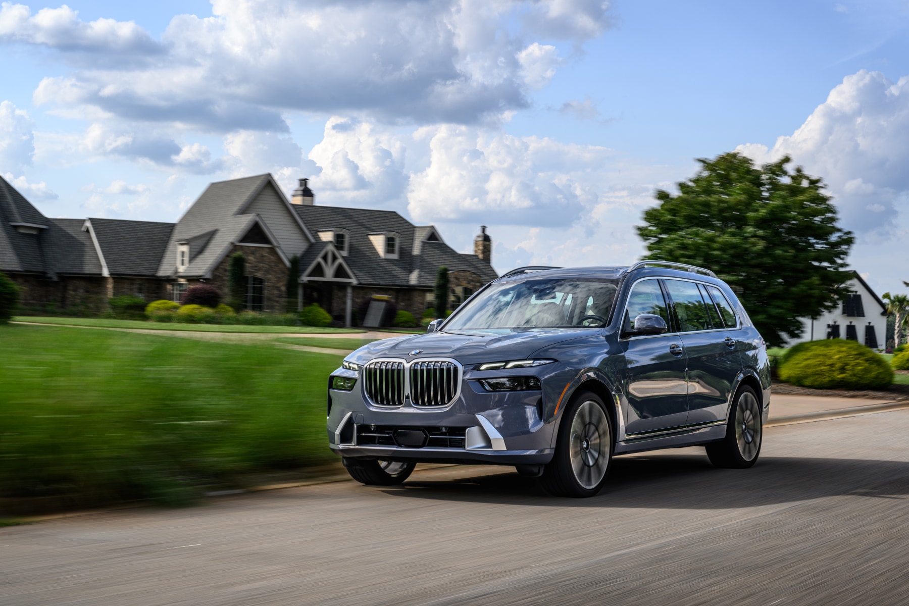 2027 BMW X7 parked in front of a house