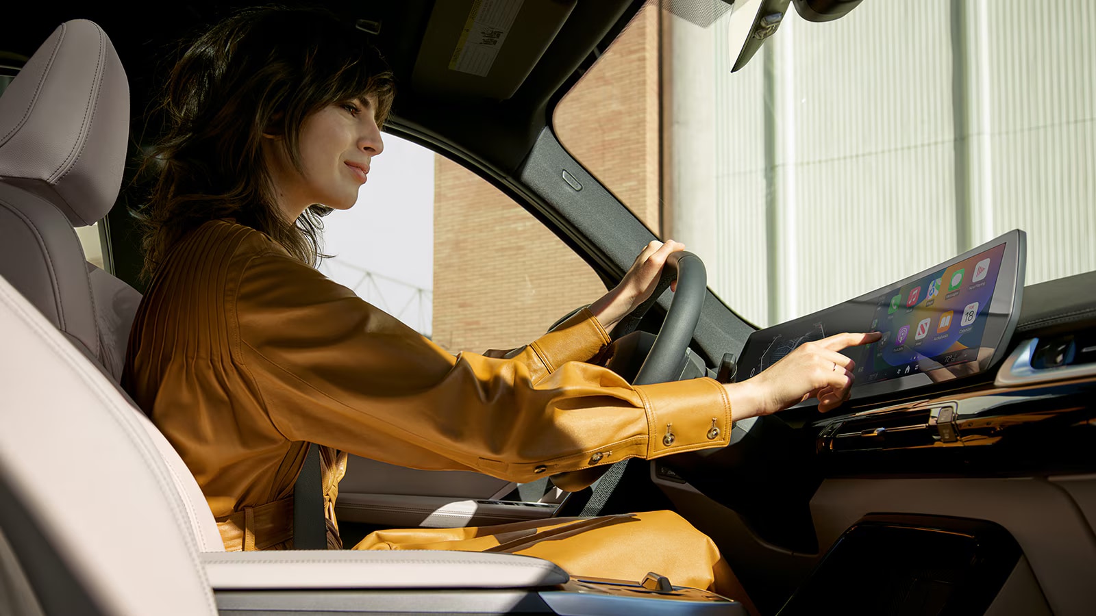 2025-bmw-x1-int-tech-woman.png