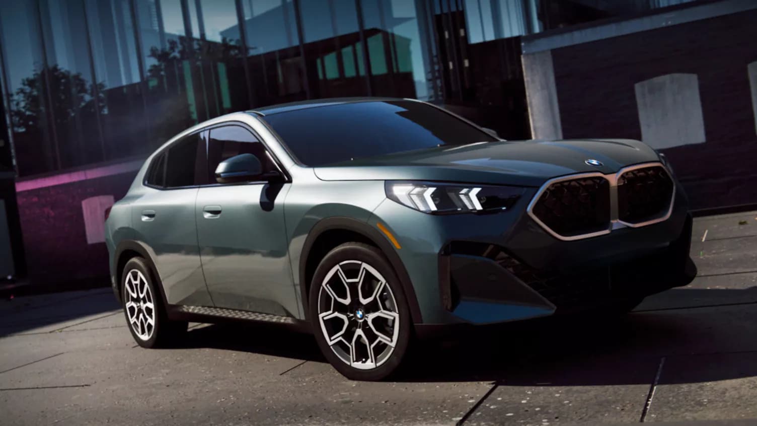 Angular-posed 2026 BMW X2 Coupe SUV in Cape York Green Metallic finish
