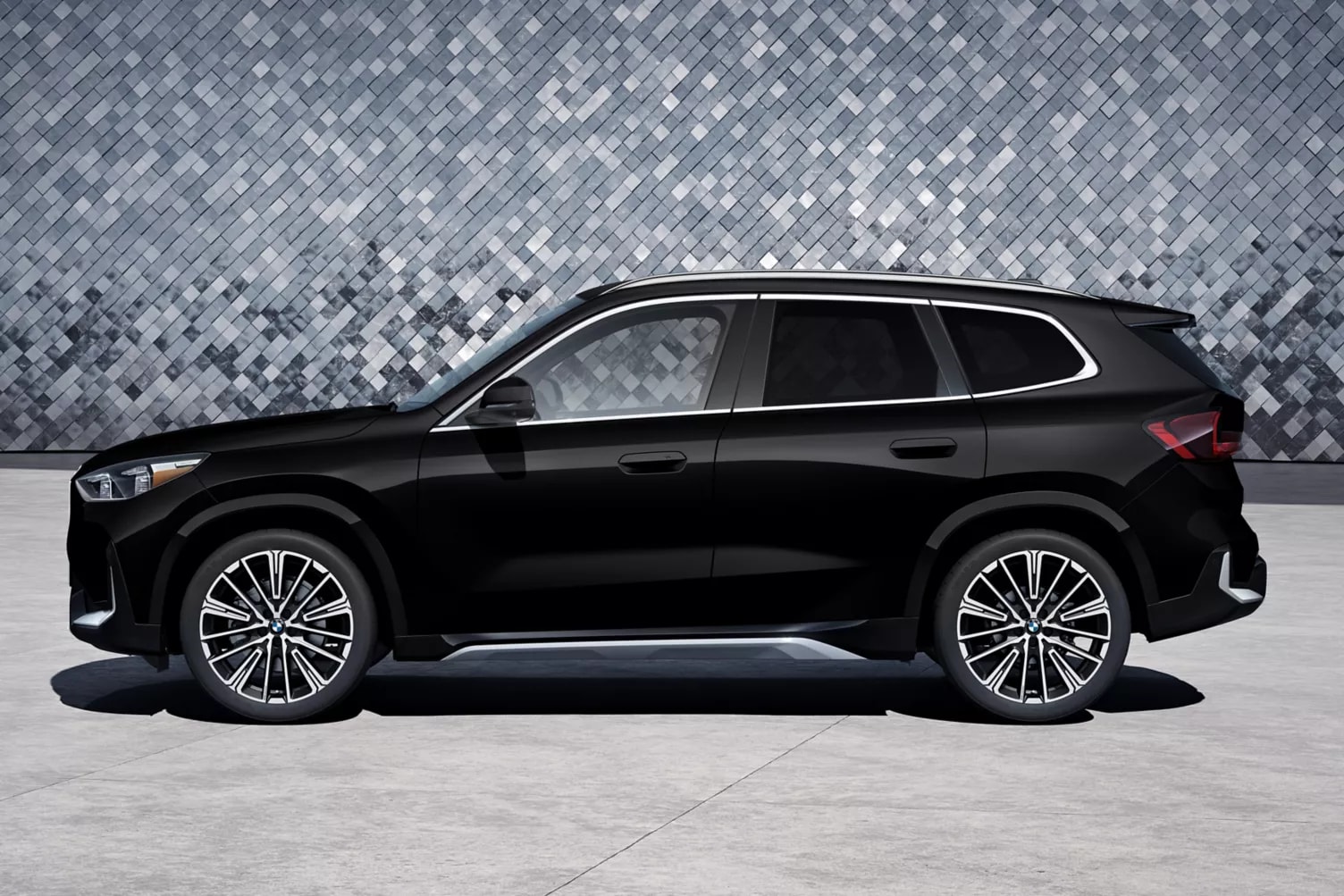 Black 2027 BMW X1 in profile