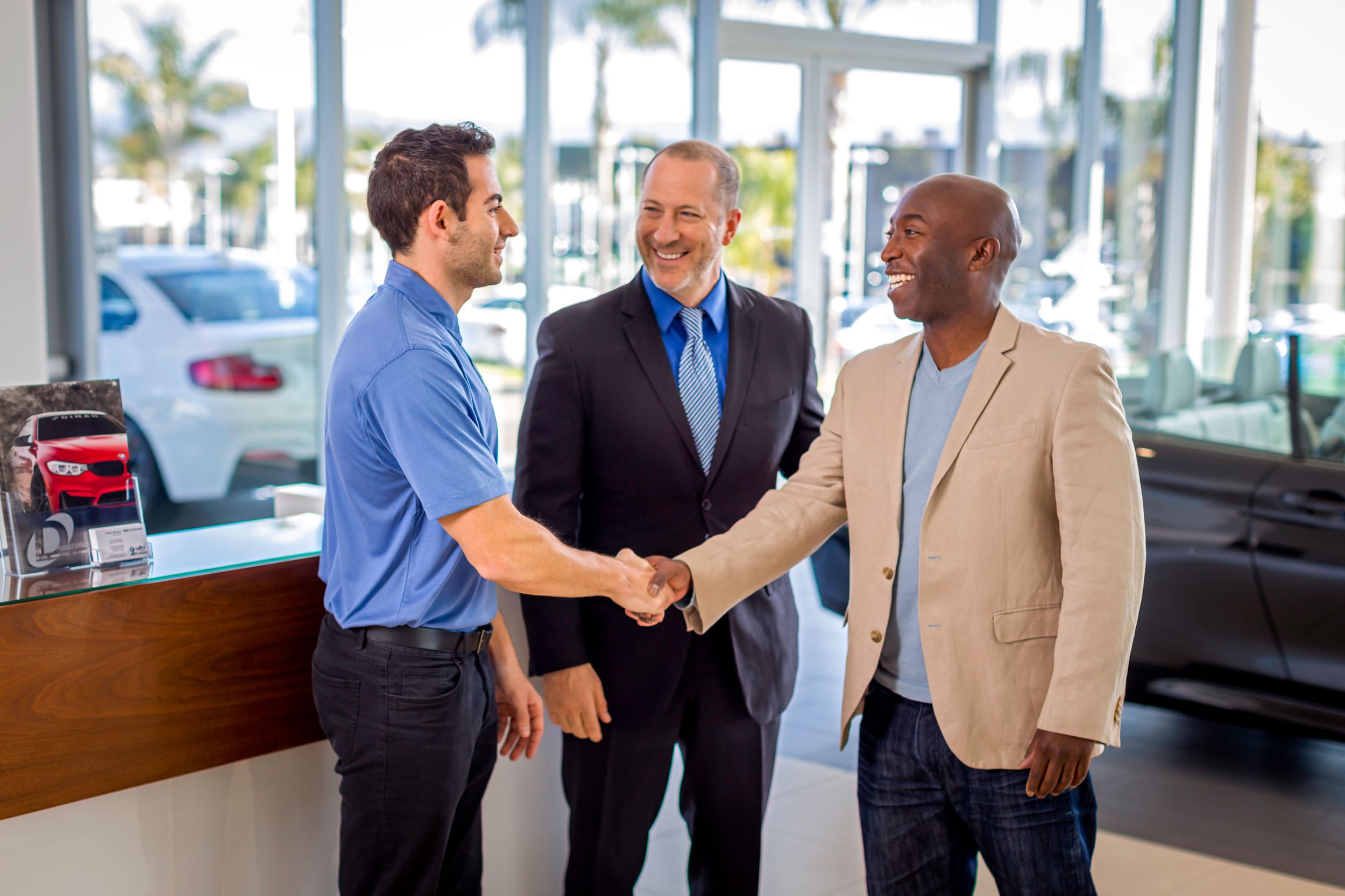 BMW representatives with a customer