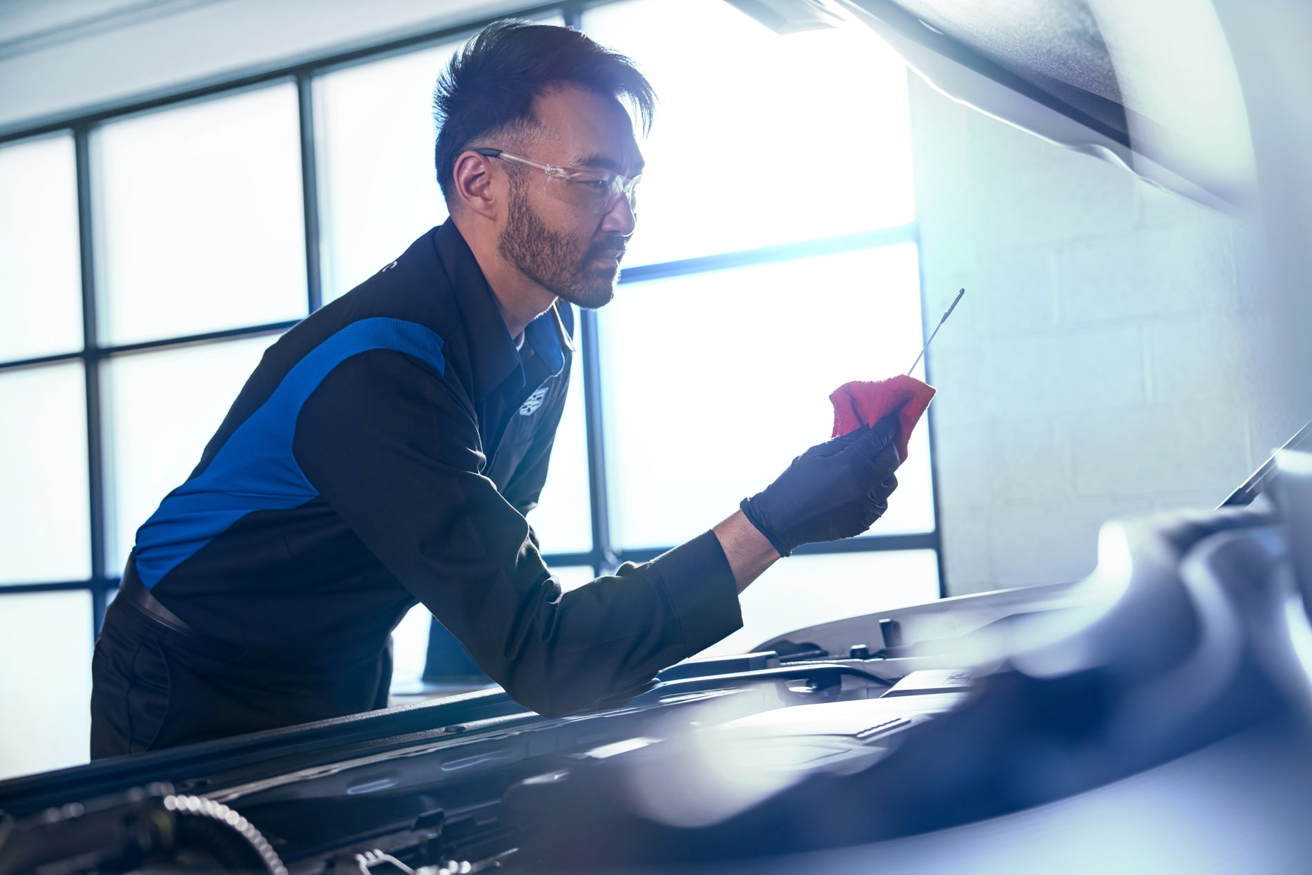 Cadillac-oil-change-man-dipstick.png