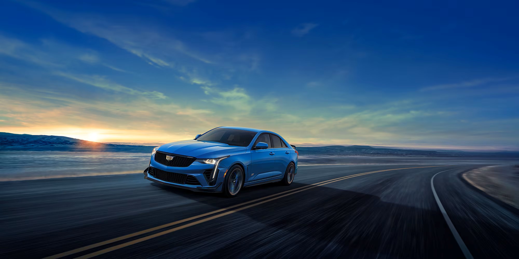 Blue 2026 Cadillac CT4-V Blackwing driving fast