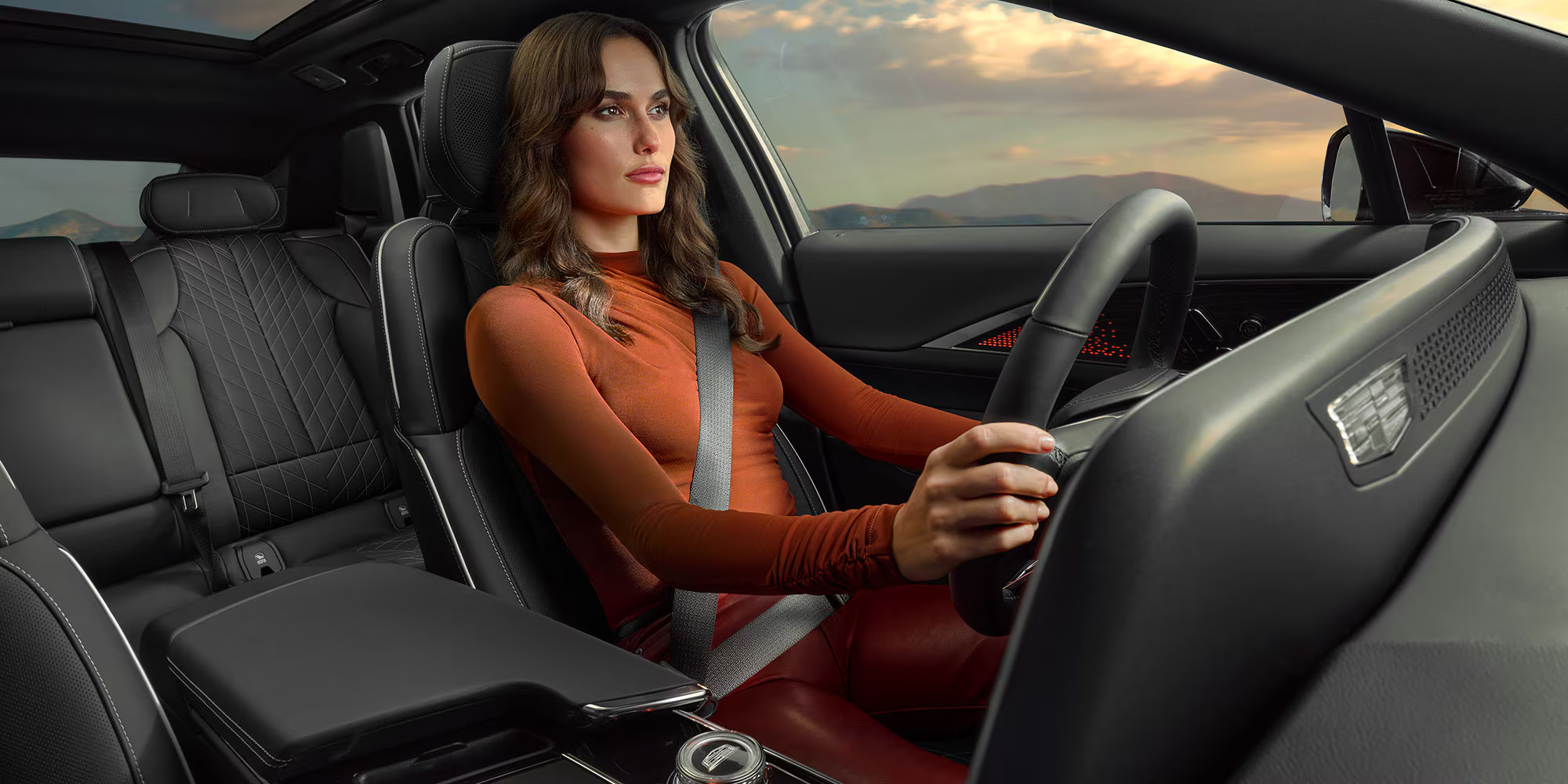 Woman driving a 2027 Cadillac LYRIQ