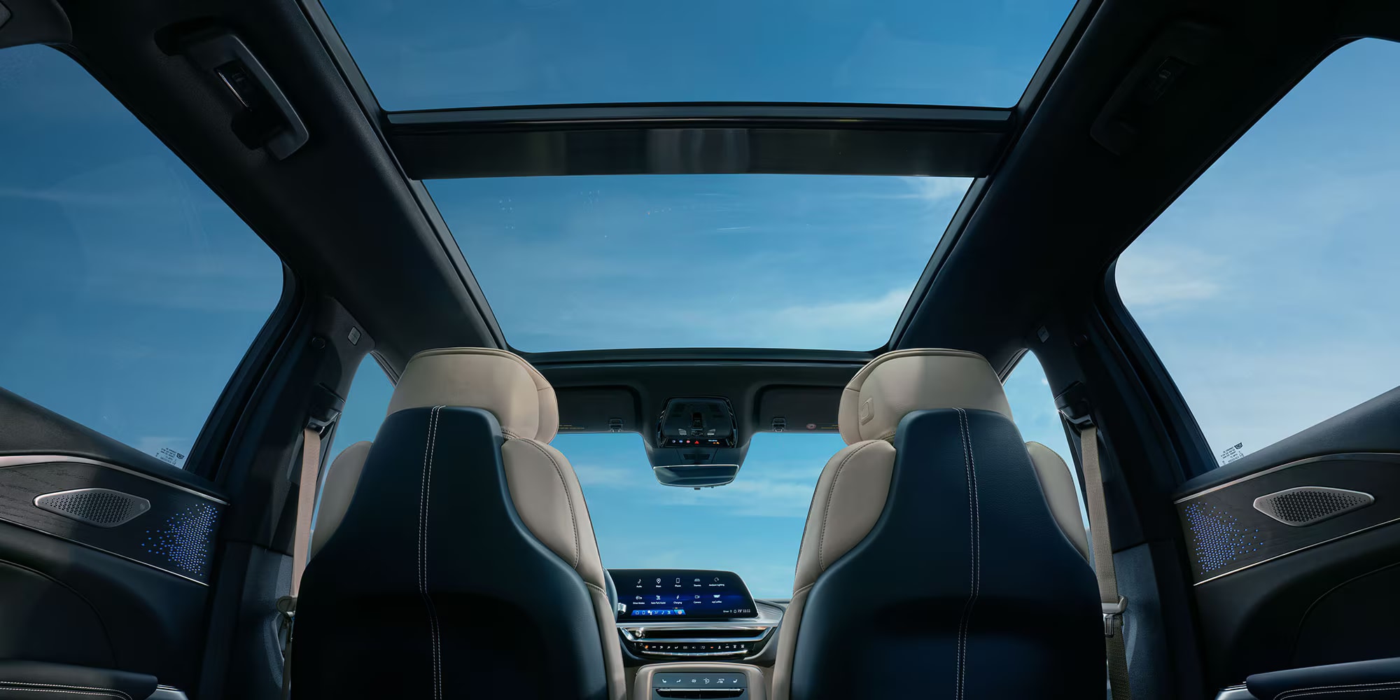 Interior view of seating, Skyroof, and tech in the 2026 Cadillac LYRIQ