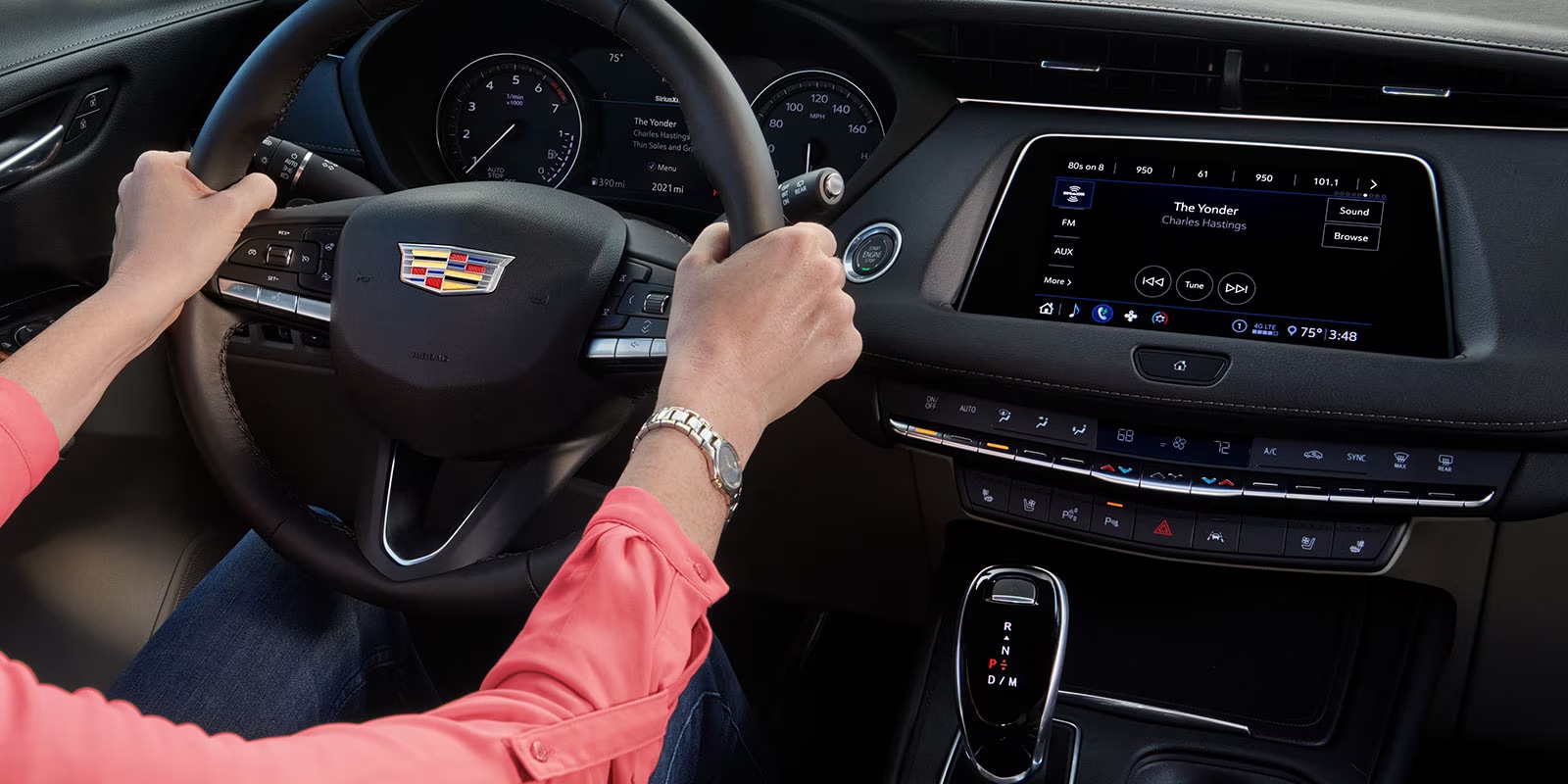 2023-cadillac-xt4-int-dash-hands.png