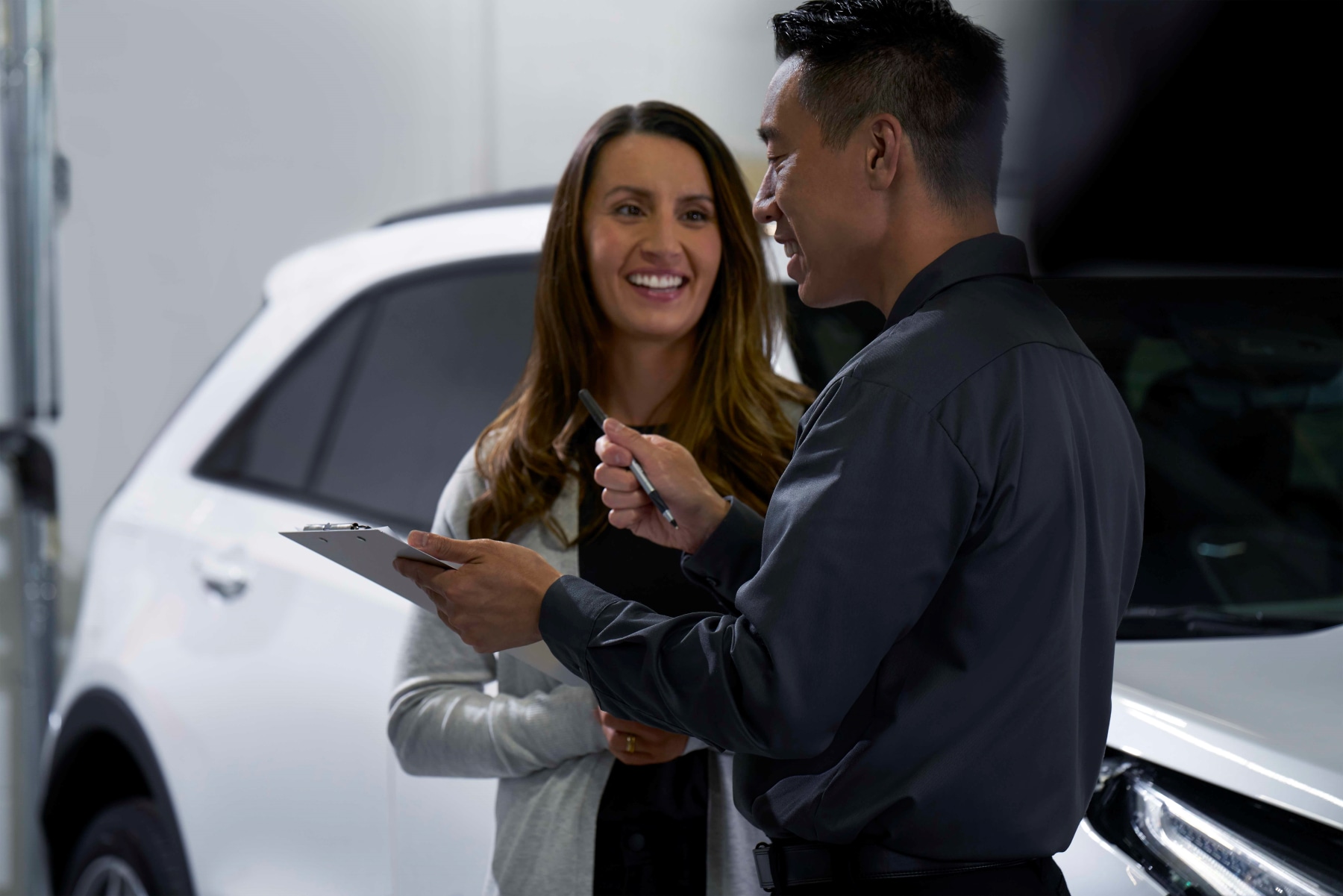 Cadillac service professional and customer