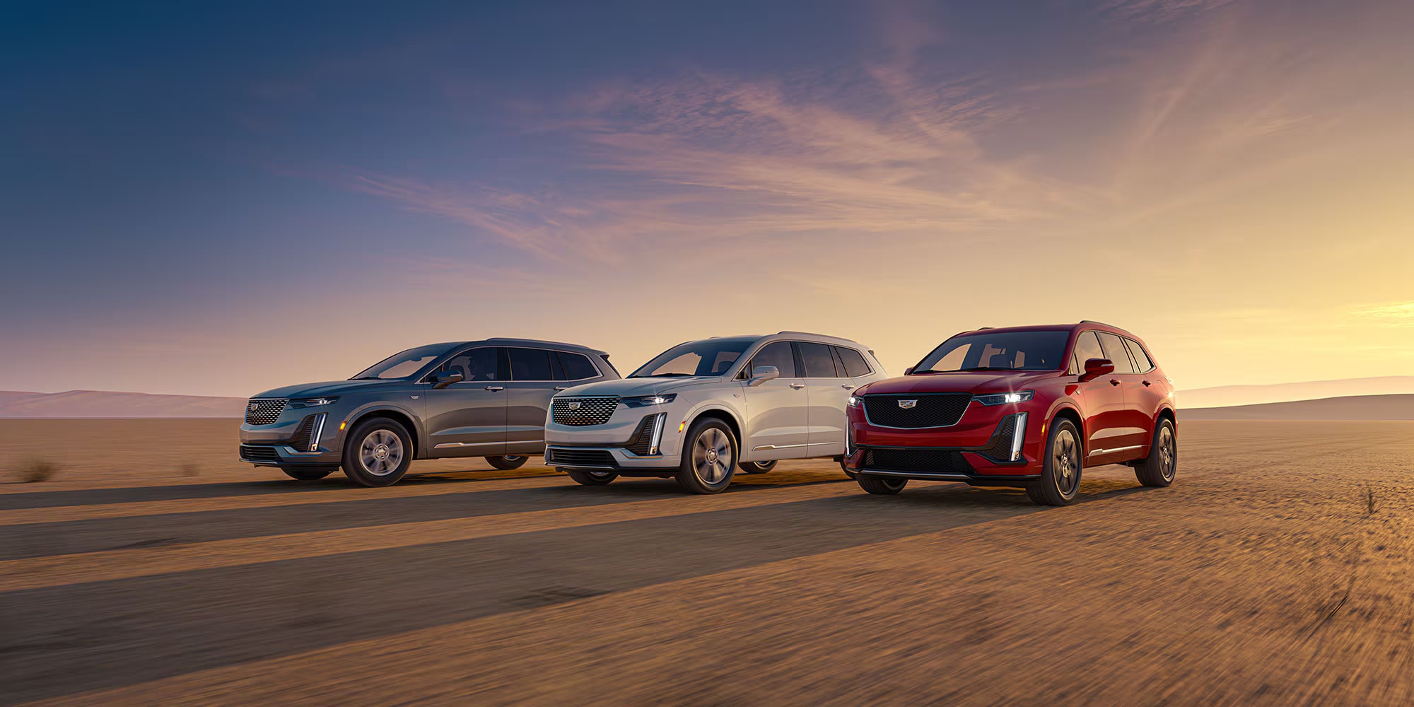 2025-cadillac-xt6-three-models-sunrise.png