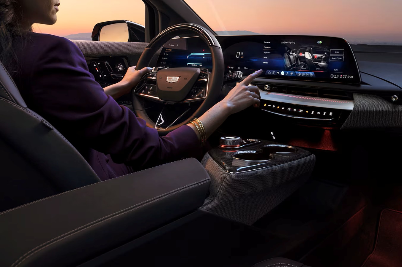 woman using touchscreen in 2026 Cadillac OPTIQ