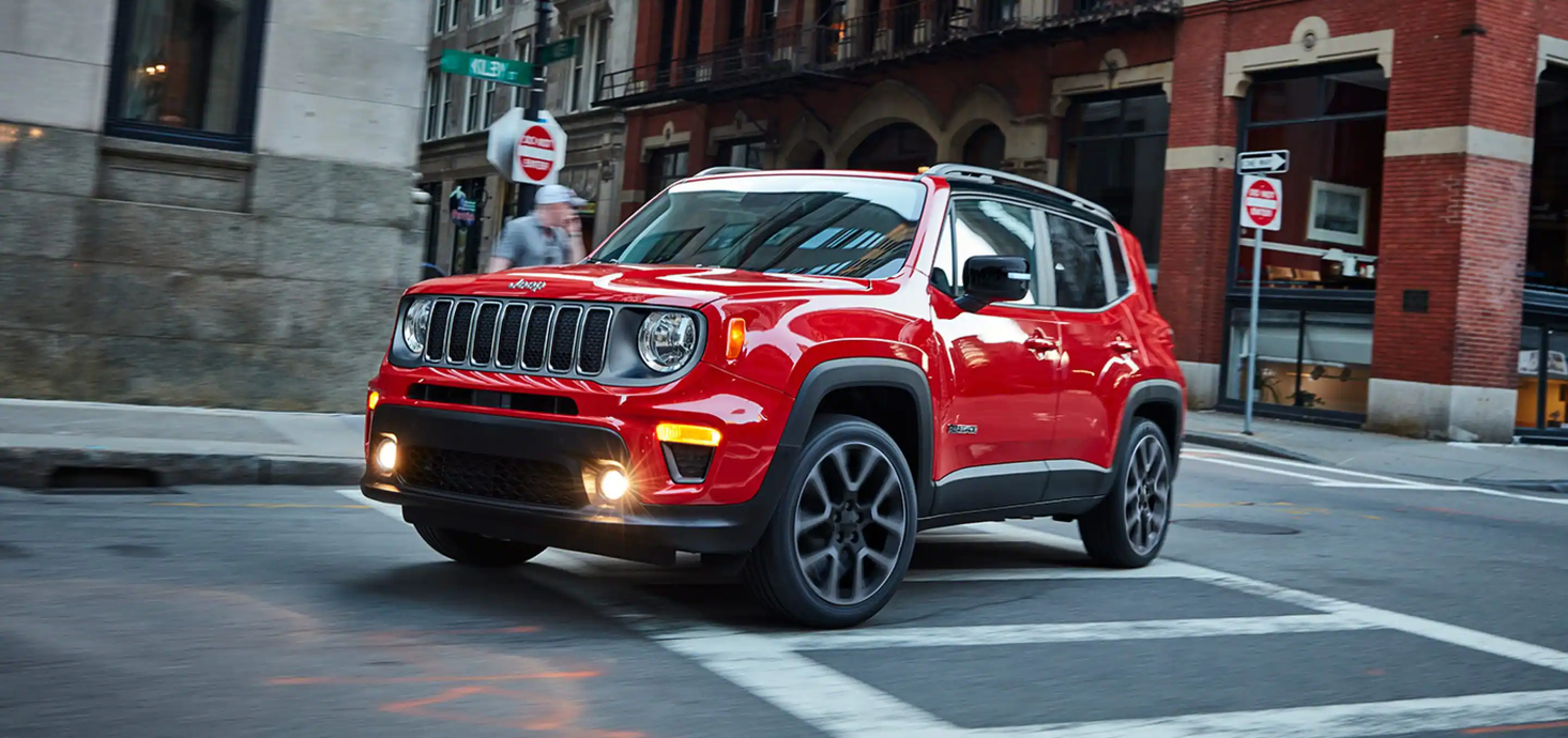 Red Jeep Renegade on a city street