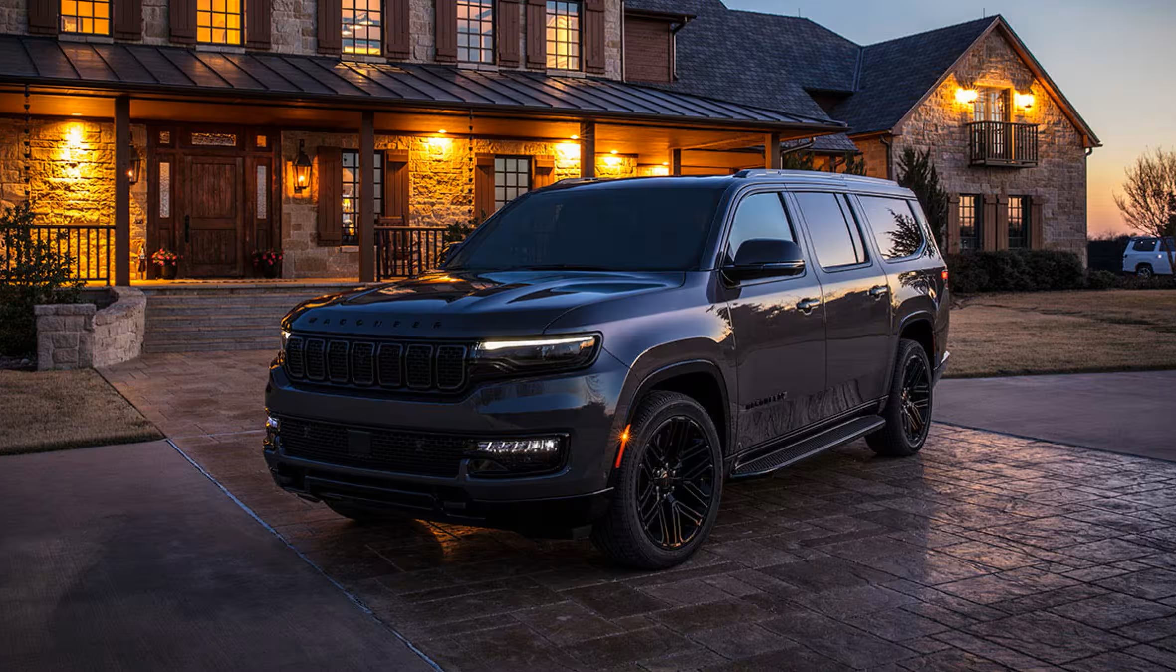 2025-wagoneer-by-jeep-parked-mansion.png