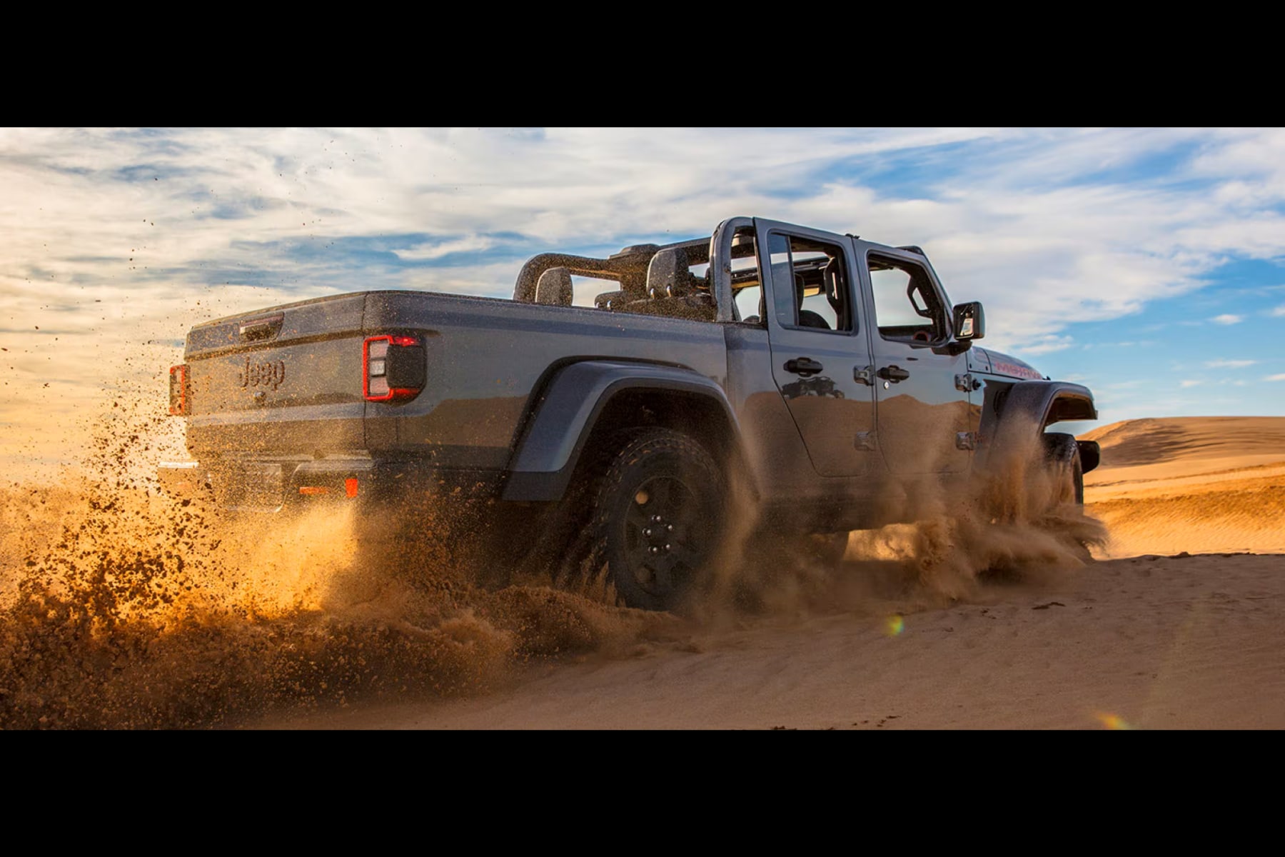2026 Jeep Gladiator driving in sand dunes