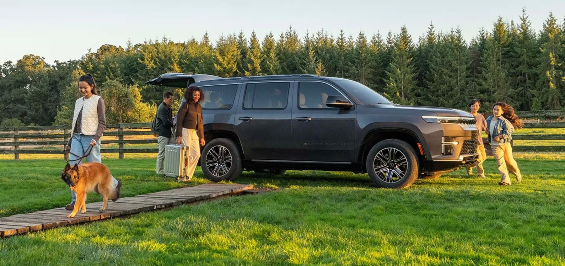 2026 Jeep Grand Wagoneer with a family and a dog
