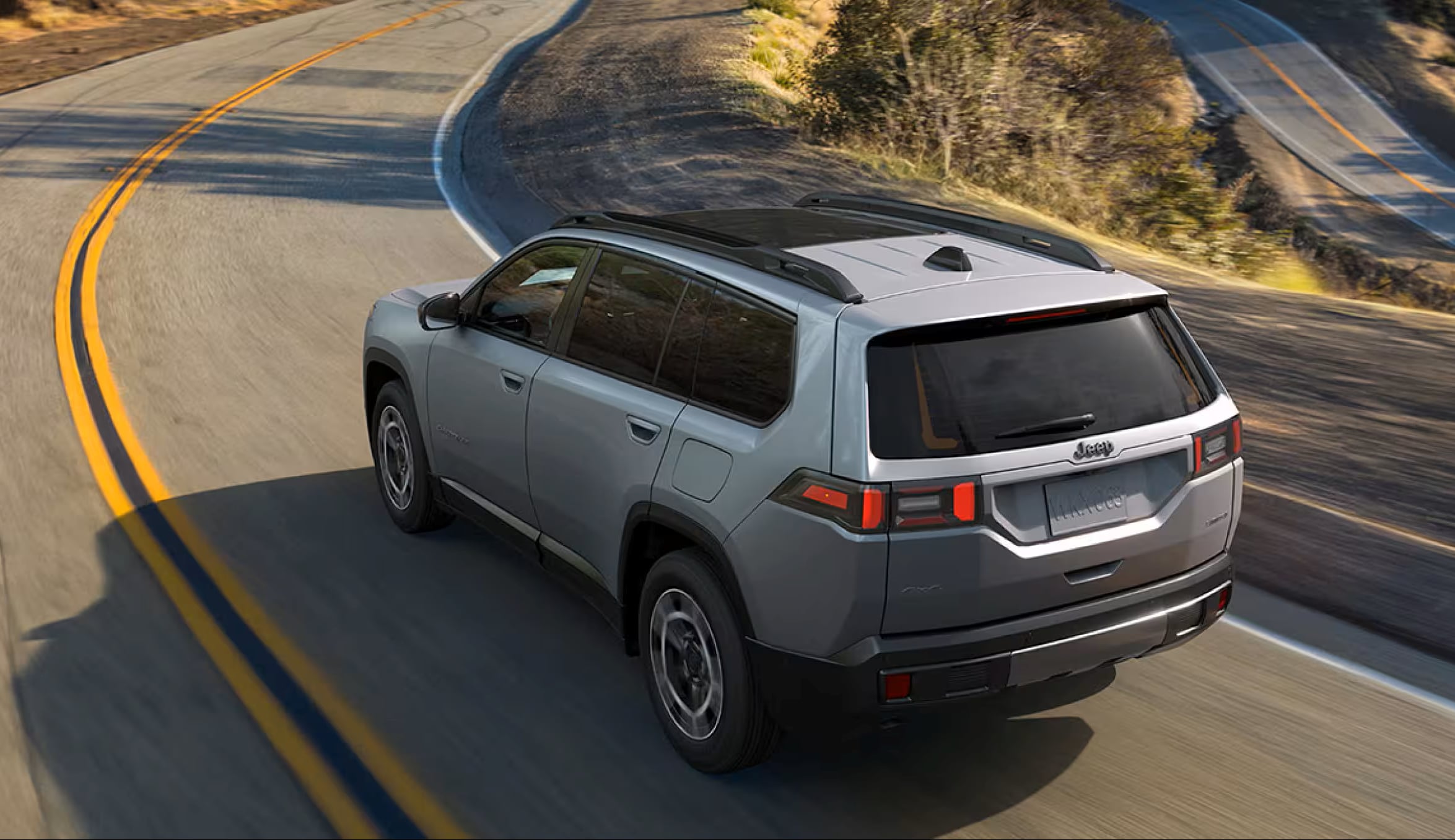 2026 Jeep Cherokee cruising the highway