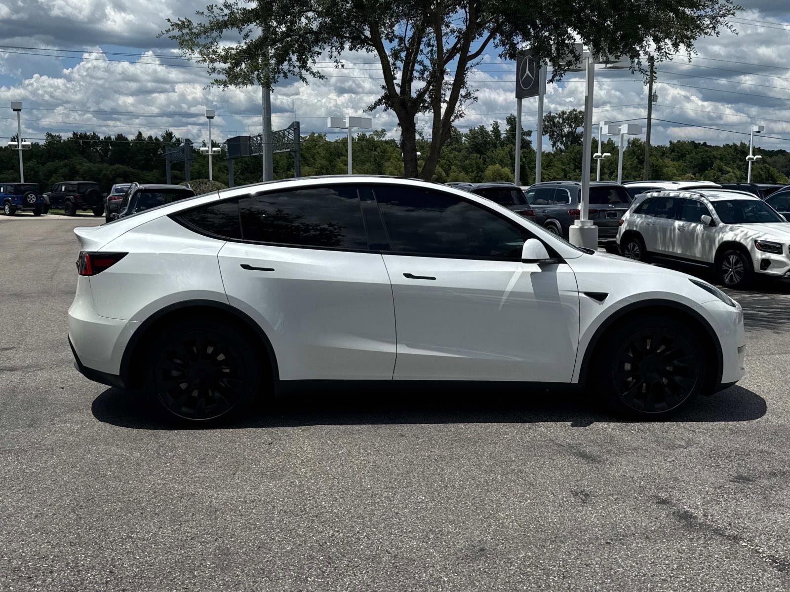 Used 2021 Tesla Model Y Long Range with VIN 5YJYGDEE7MF074162 for sale in Lakeland, FL