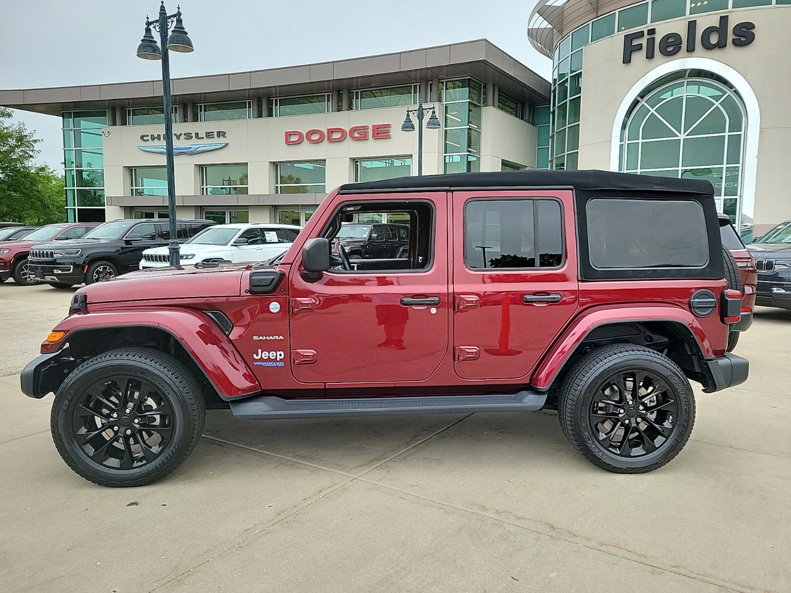 Used 2021 Jeep Wrangler Unlimited Sahara 4XE with VIN 1C4JJXP67MW716580 for sale in Lakeland, FL