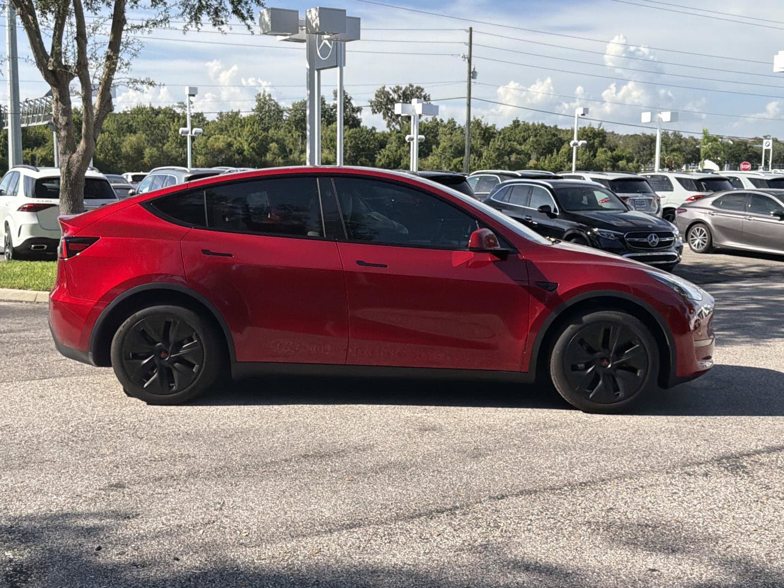 Used 2024 Tesla Model Y Long Range with VIN 7SAYGDEE4RA222677 for sale in Lakeland, FL