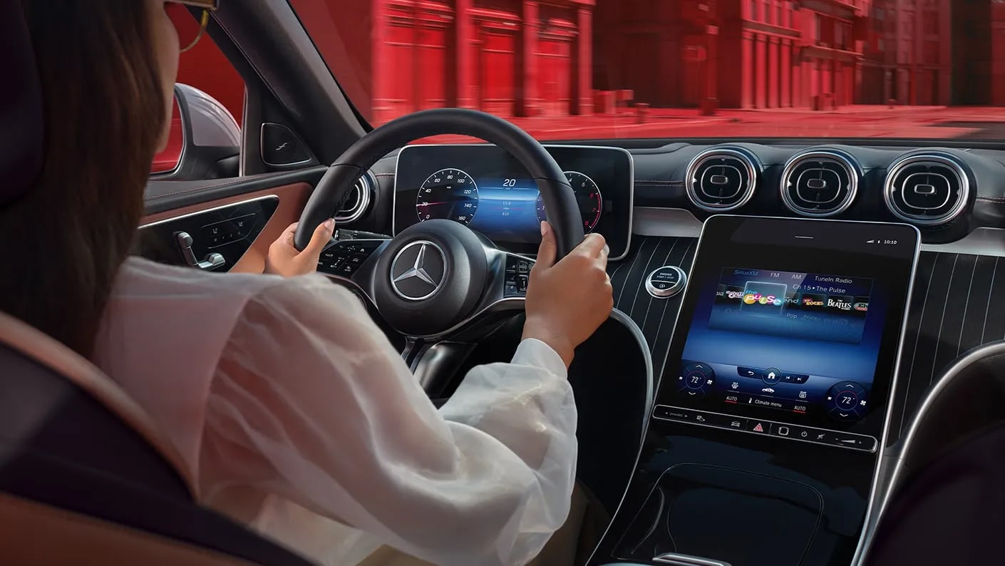 Woman driving a Mercedes-Benz 