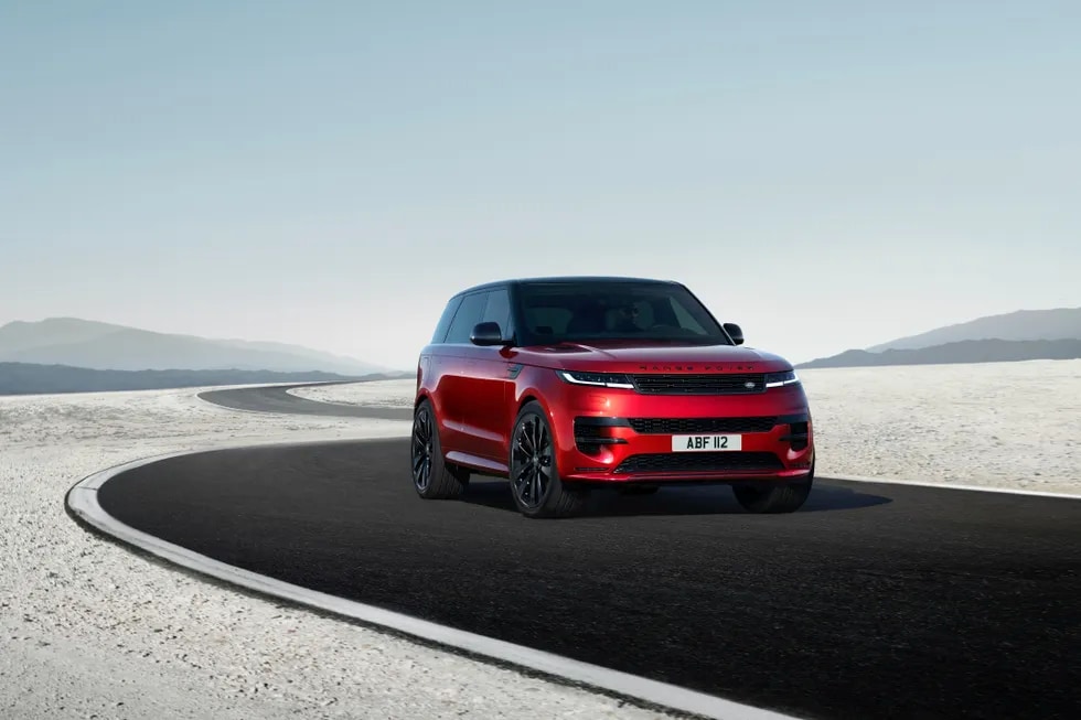 Red 2023 Range Rover Sport cruising