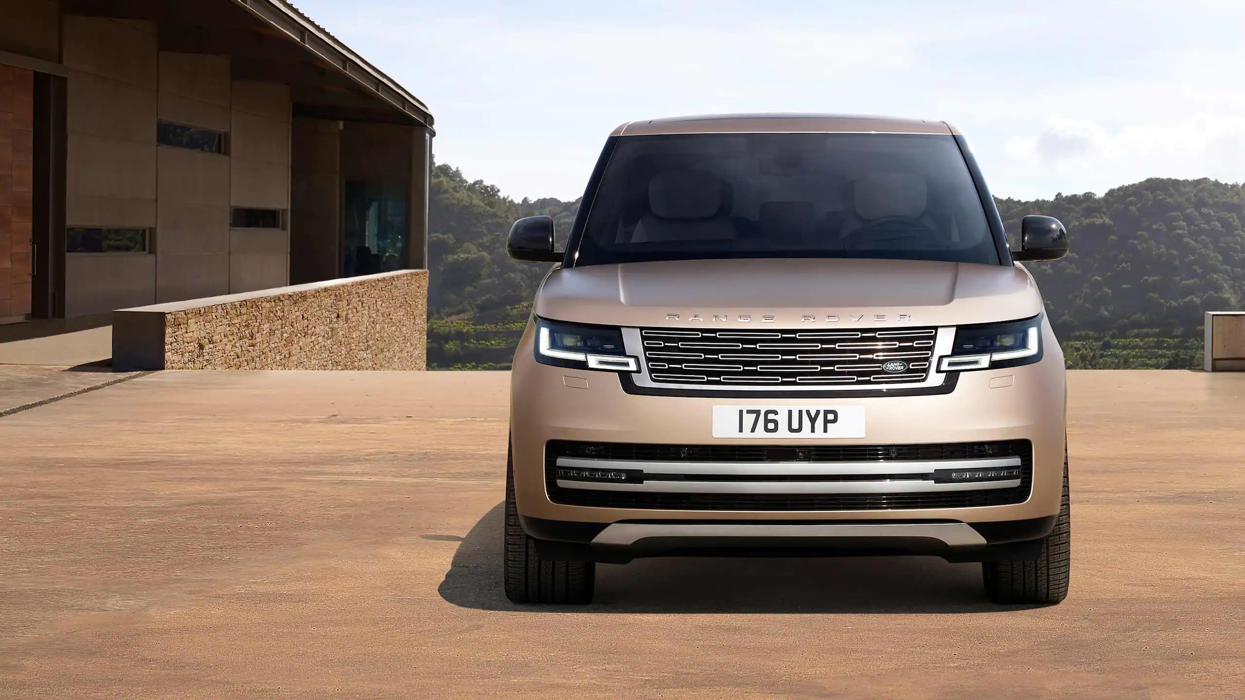 Certified Pre-Owned 2023 Range Rover parked by house