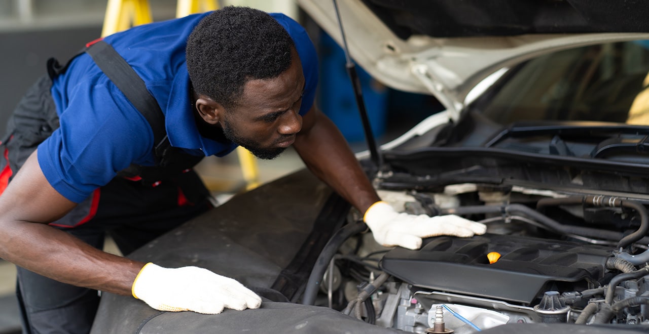 mechanic-checking-engine.jpg
