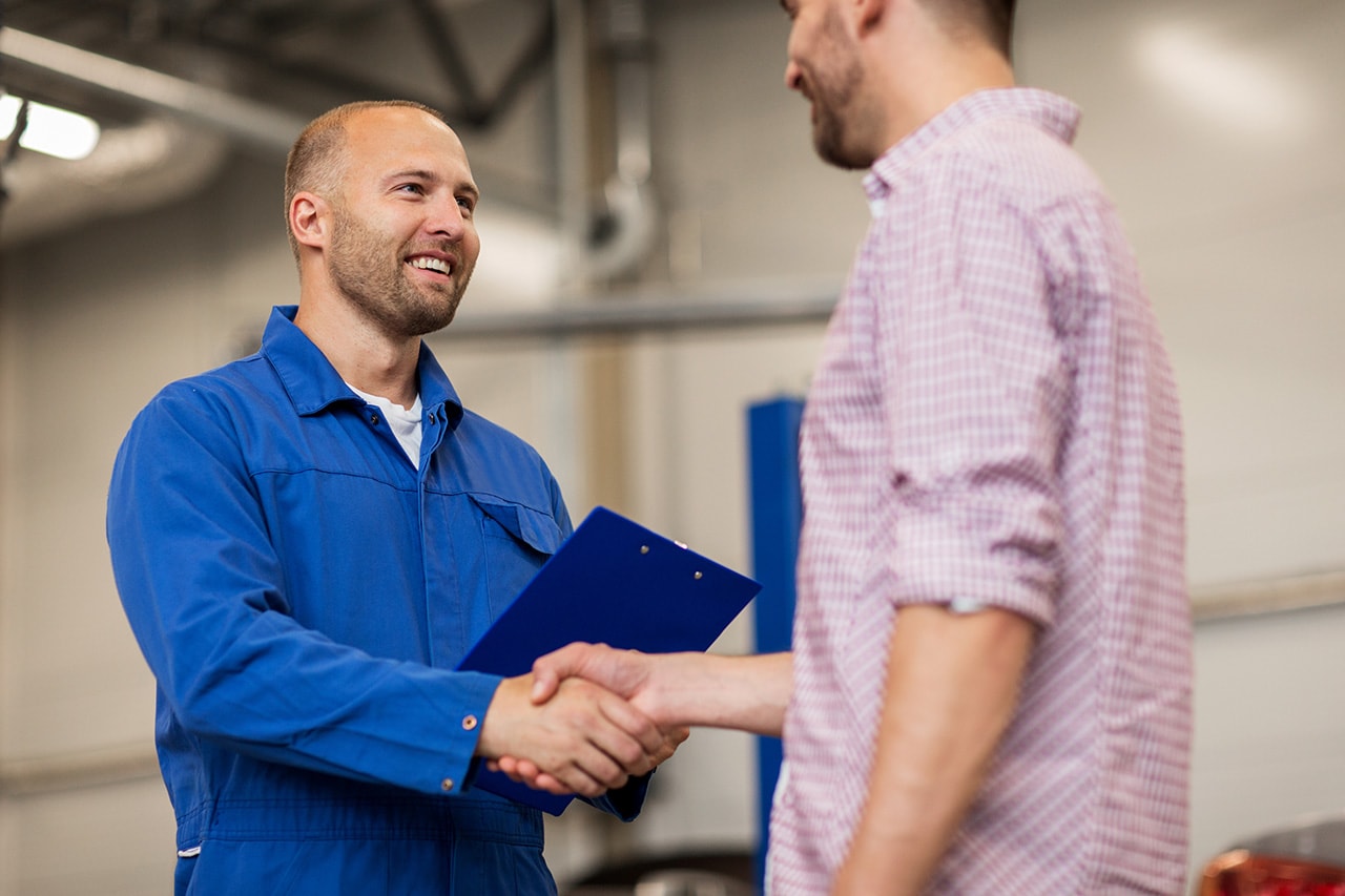 Technician and guest shaking hands