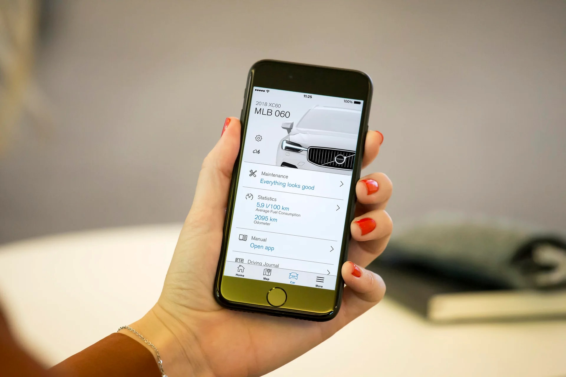 Volvo Connected Vehicle Services image with smartphone