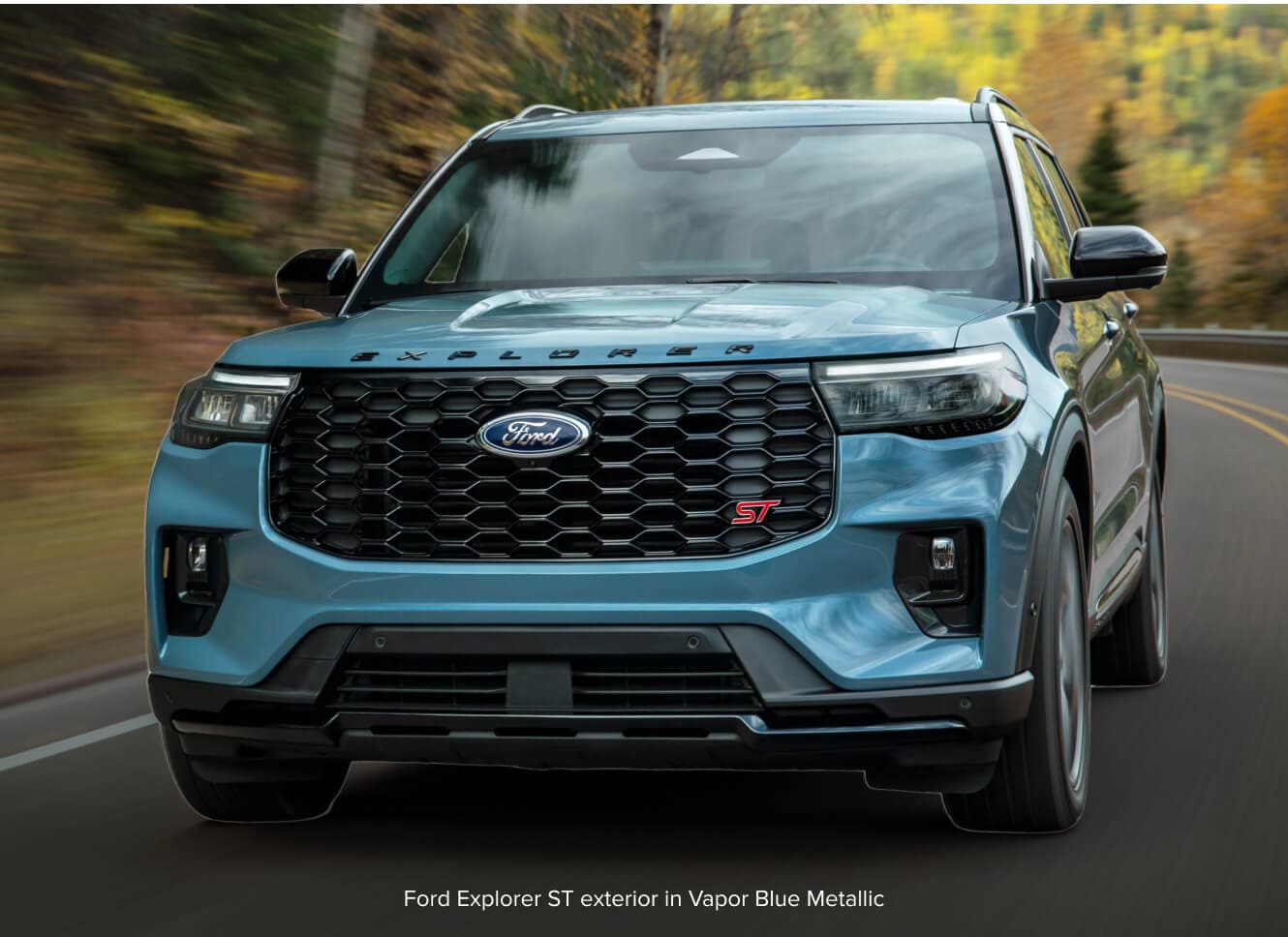 Ford Explorer ST accelerates through a sweeping mountain.