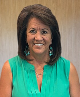 Staff member Cindy Cox from ID_a9f9c082451b