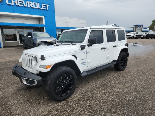Used 2021 Jeep Wrangler Unlimited Sahara 4XE with VIN 1C4JJXP60MW771825 for sale in Crookston, Minnesota