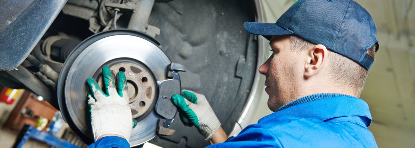 Mechanic working on brake pads