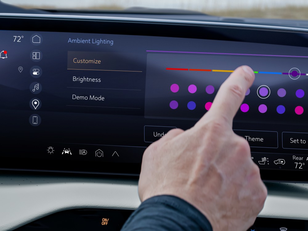  Person customizing ambient lighting in a 2026 Buick Enclave
