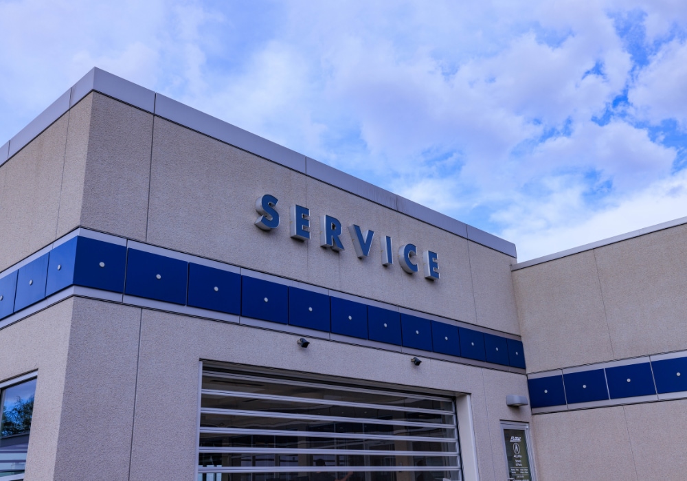 Exterior of service center building at Flow Acura in Winston-Salem, NC