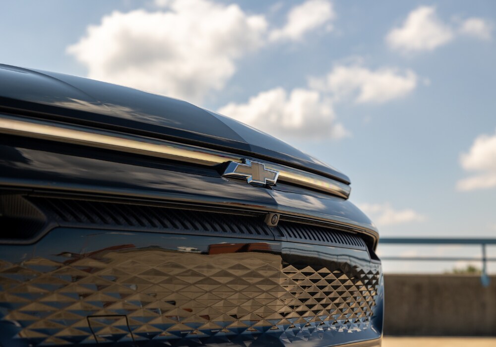 Close up shot of the front grille of the 2024 Equinox EV with the Chevy logo visible