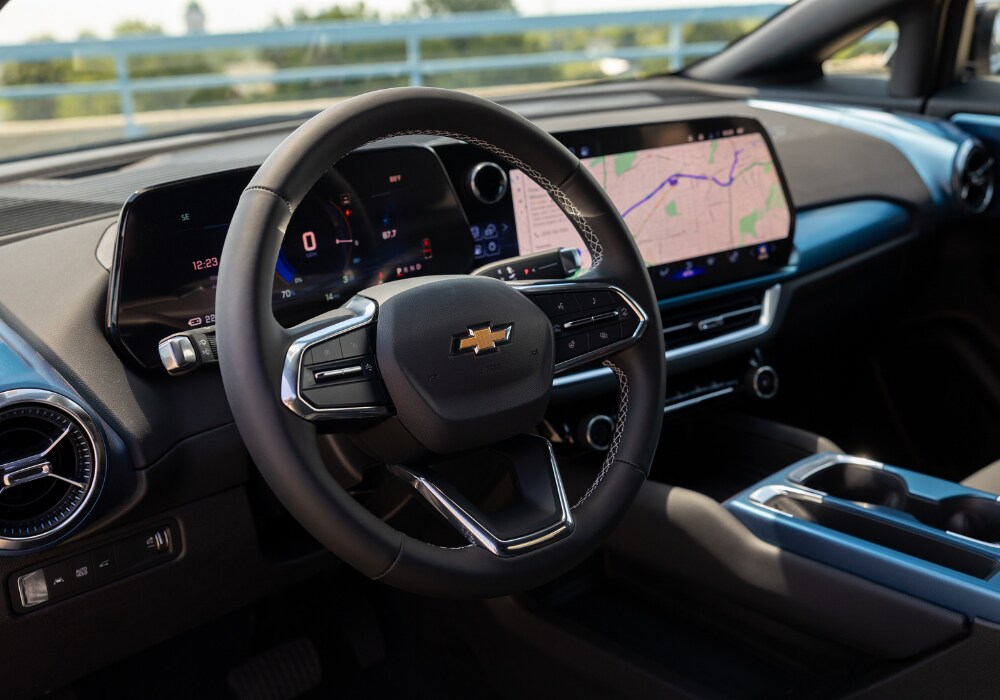 Chevy Equinox EV interior front dash display with Google Maps visible on the infotainment system