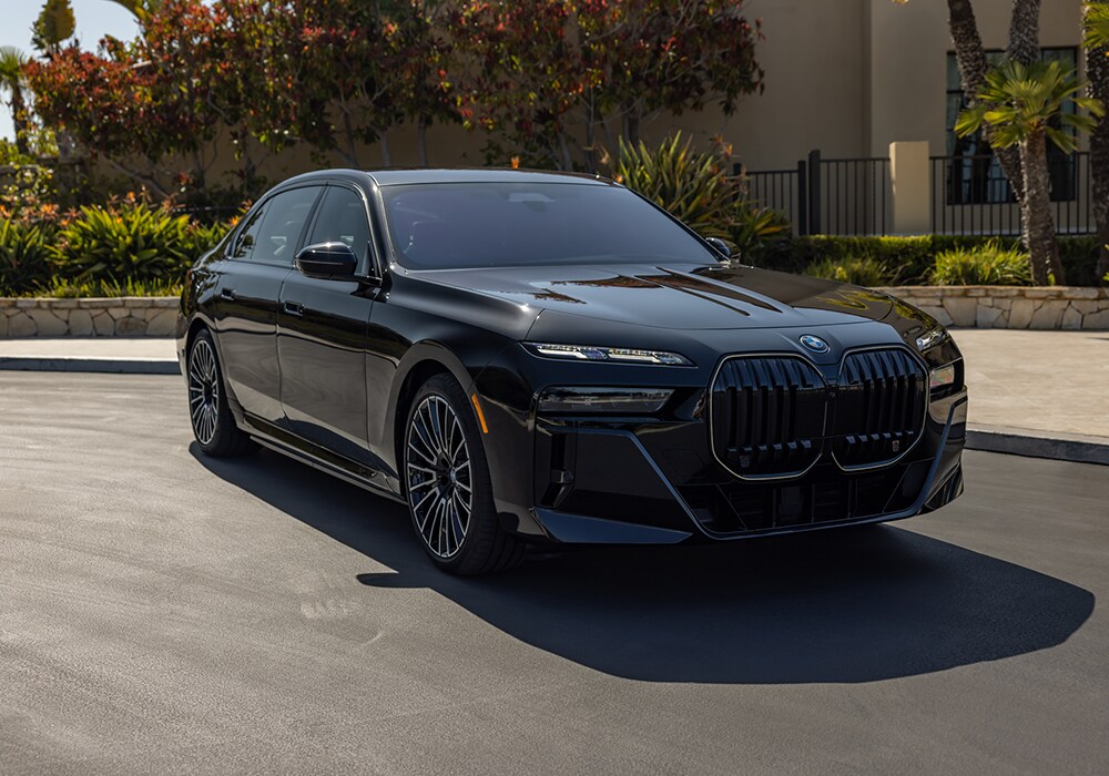 2025-bmw-i7-for-sale-winston-salem.png Black 2025 BMW i7 parked on a paved surface with foliage in the background