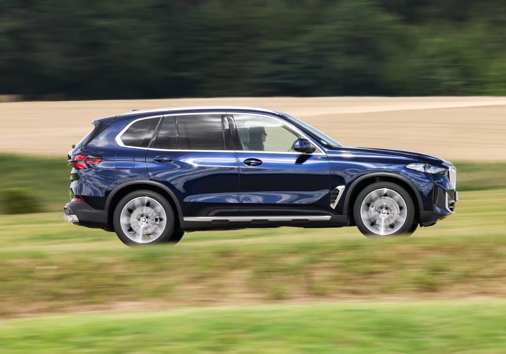 new-bmw-x5-for-sale New BMW X5 driving down a road