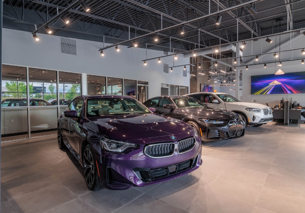 Lineup of BMW models for sale parked inside of the BMW Charlottesville showroom