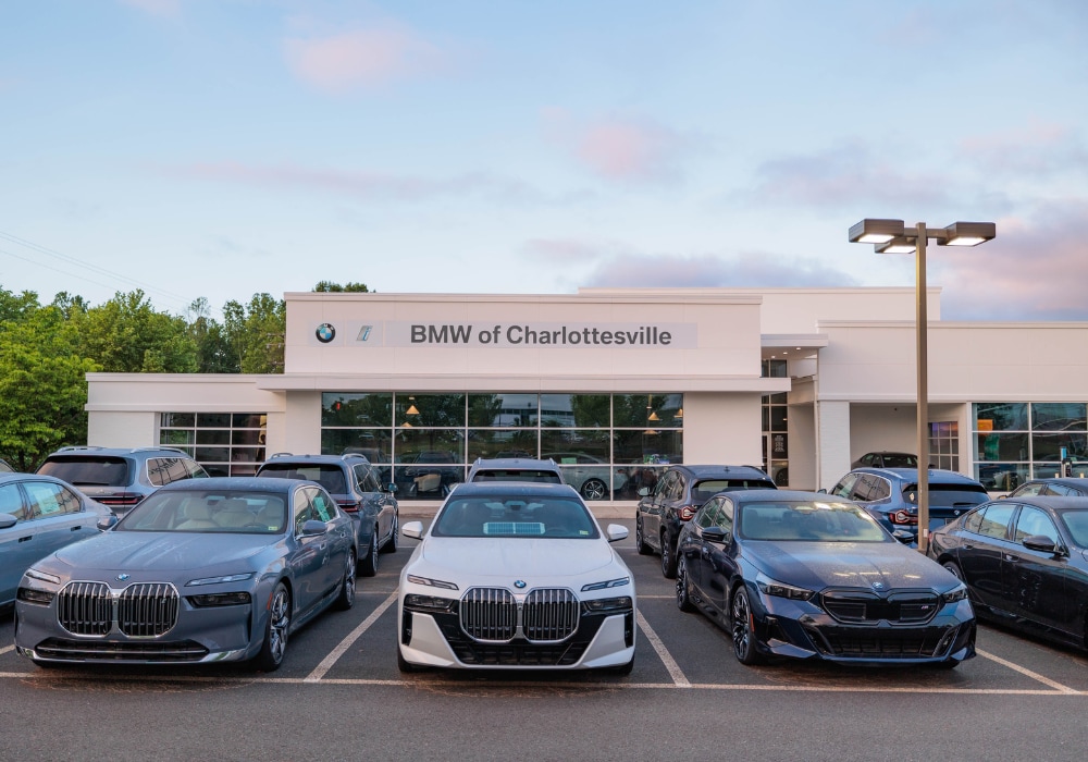 parking lot full of BMW cars for sale, in front of a BMW dealership located in Charlottesville, VA