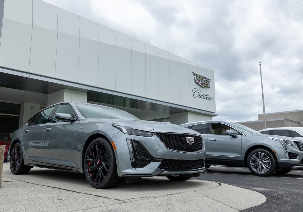 Lineup of Cadillac cars for sale parked in front of Flow Cadillac of Wilmington