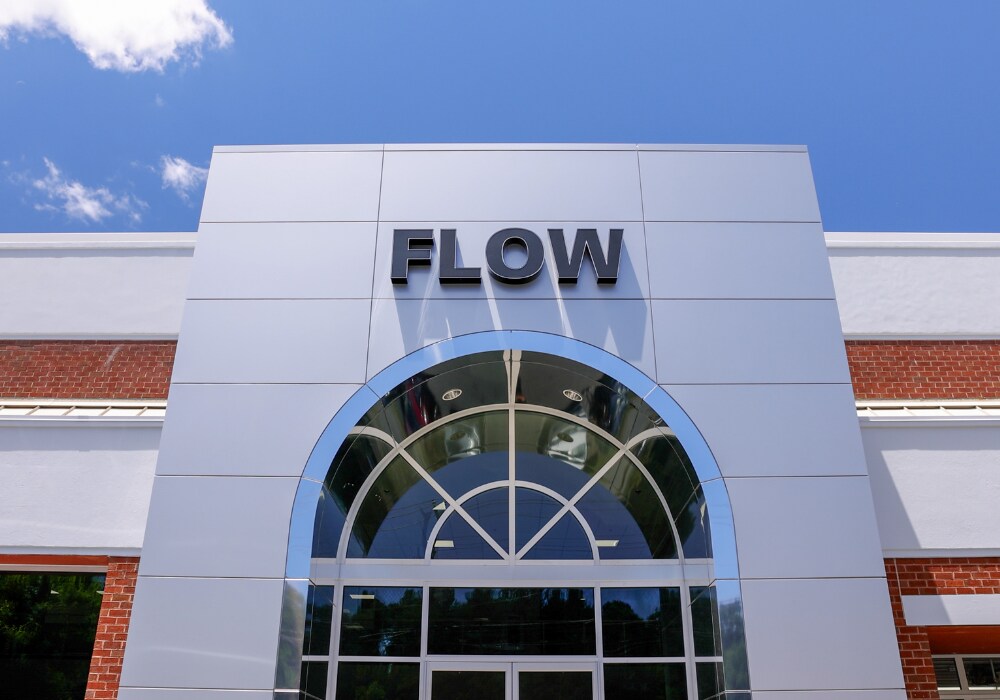 Flow logo on the front of the Flow Chrysler Dodge Jeep Ram of Charlottesville dealership