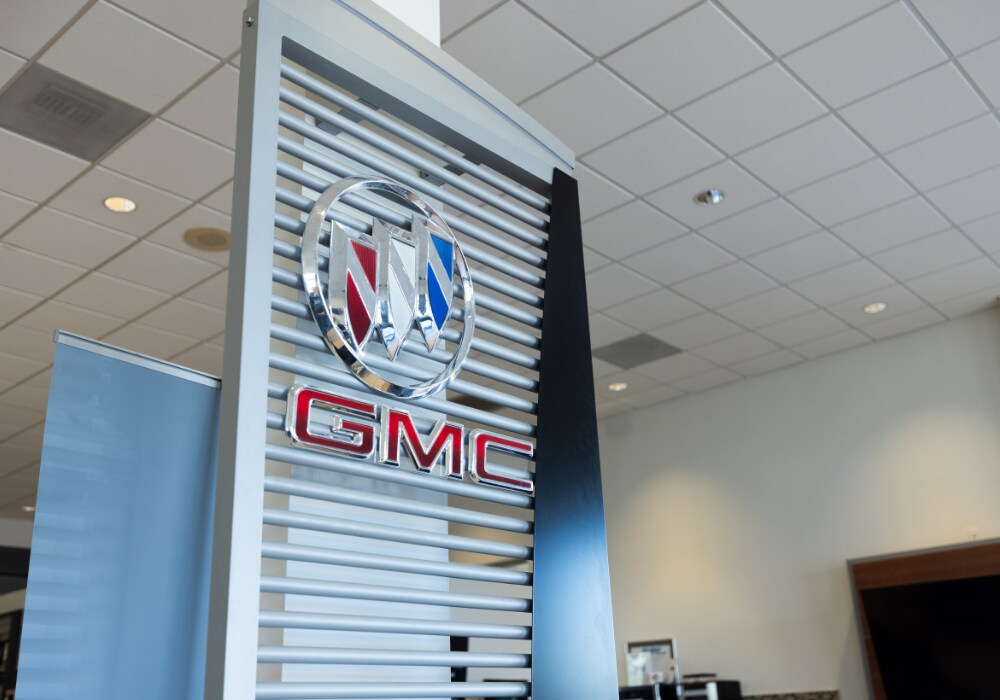 GMC and Buick logos inside the Flow Buick GMC Greensboro dealership