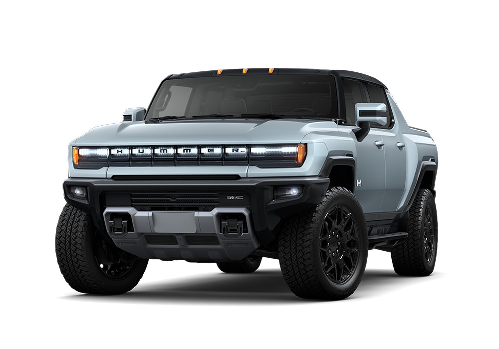 2025-gmc-hummer-ev-pickup.jpg Front exterior view of a 2025 GMC Hummer EV Pickup for sale. The truck is light gray and the background is white
