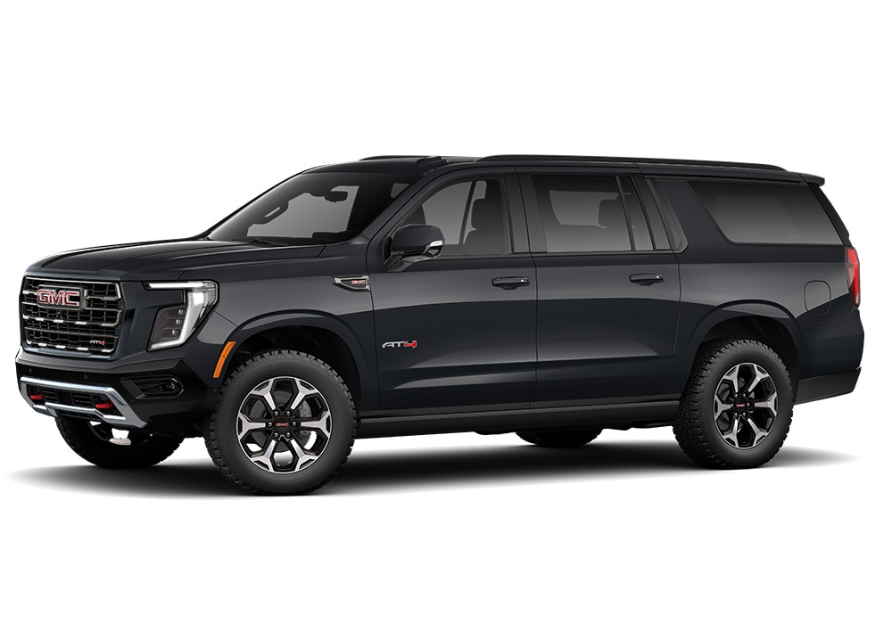 new-gmc-yukon-xl-greensboro.jpg Driver's side exterior view of a 2025 GMC Yukon XL. The SUV is black in front of a white background