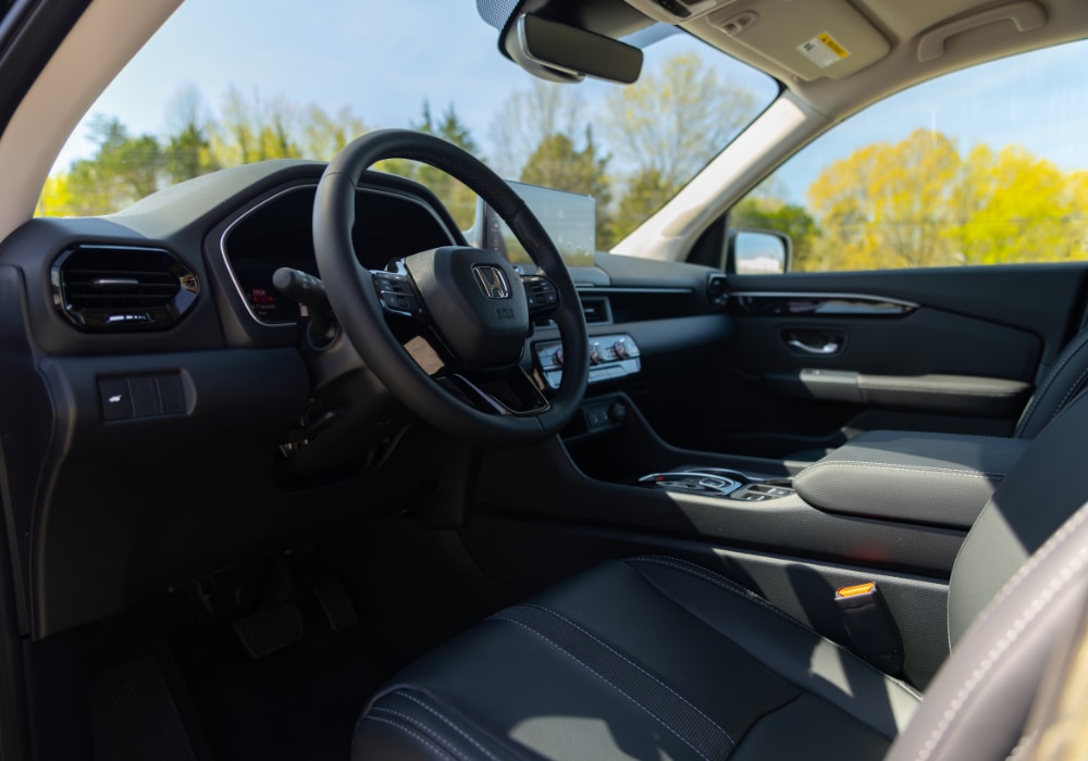 Honda CR-V interior including the steering wheel and driver's seat