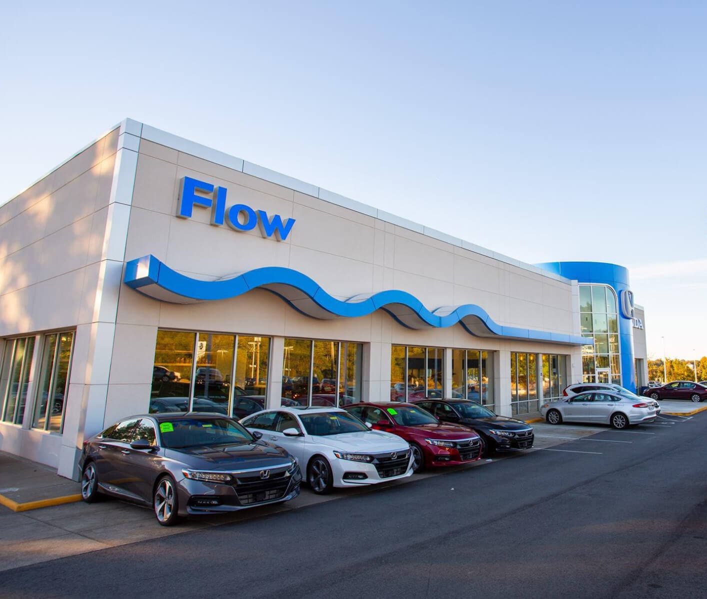 Row of used Hondas for sale outside at Flow Honda dealership in Winston-Salem
