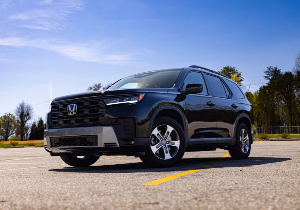 2026 Honda Pilot SUV parked with a blue sky in the background