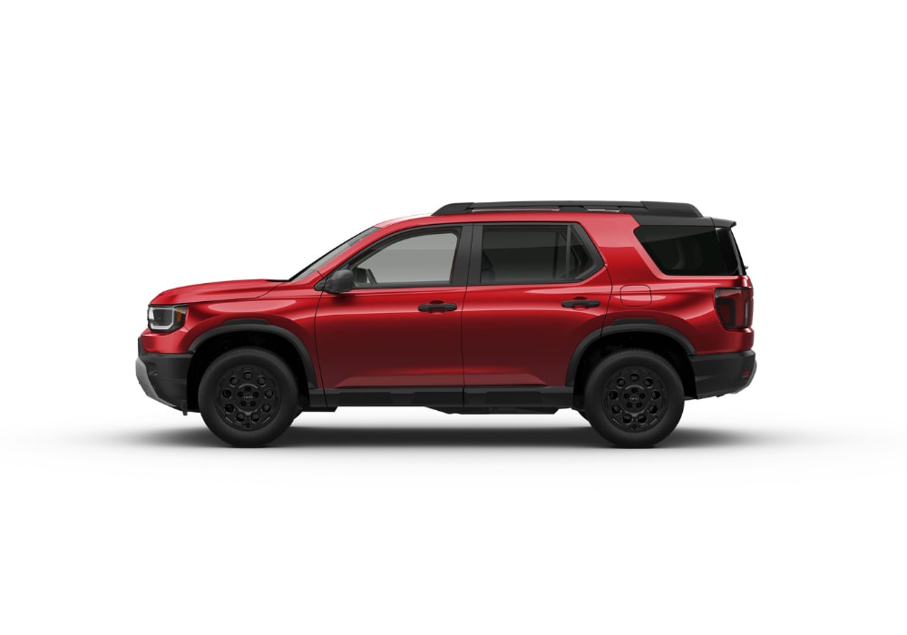 Driver's side view of the new Honda Passport SUV. The car is red in front of a white background
