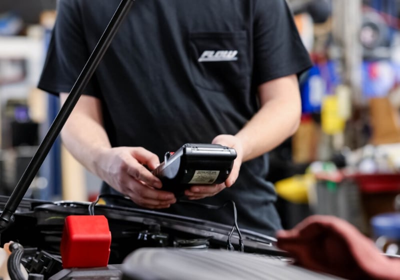 service-repairs-honda.jpg Employee at Flow Honda Winston-Salem running a diagnostic test on a car in the Honda service department
