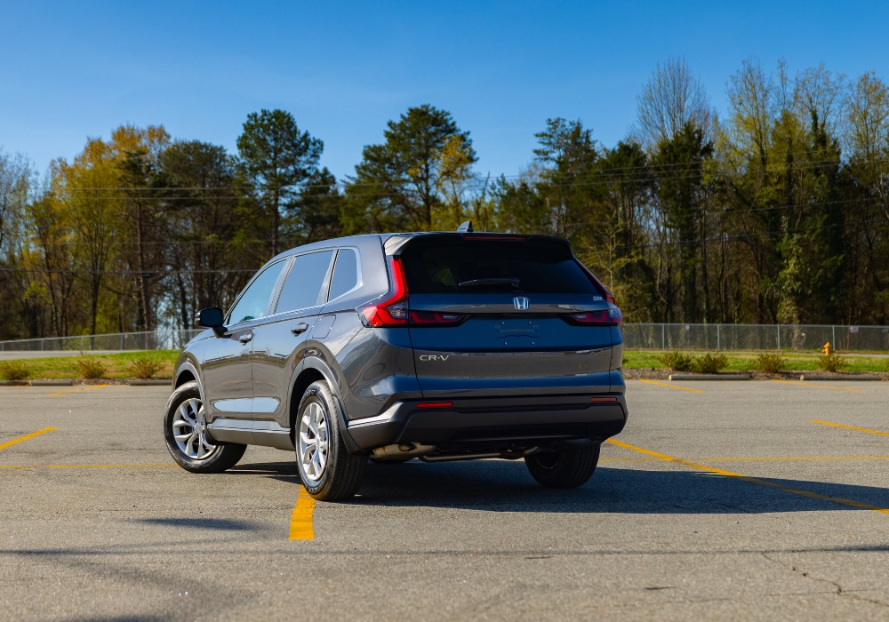 Rear exterior view of a 2026 Honda CR-V parked in an empty lot